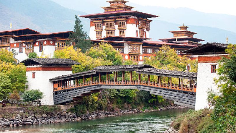 Punakha Dzong, ‘The Palace of Bliss or Great Happiness’ is a fortress and monastery sitting at the confluence of the Mo Chhu (Female) and Pho Chhu (Male) rivers and is accessed by crossing the Bazam Bridge, originally built in the 17th century. The Royal Buddhist Kingdom of Bhutan, mountainous country in the Himalayas known for its monasteries, fortresses (or dzongs) and dramatic landscapes, ranging from subtropical plains to steep mountains and valleys, all of which are popular trekking destinations. Most famous landmark is Paro Taktsang monastery or Tiger’s Nest, clinging to precipitous cliffs above Paro Valley. Its Capital is Thimphu